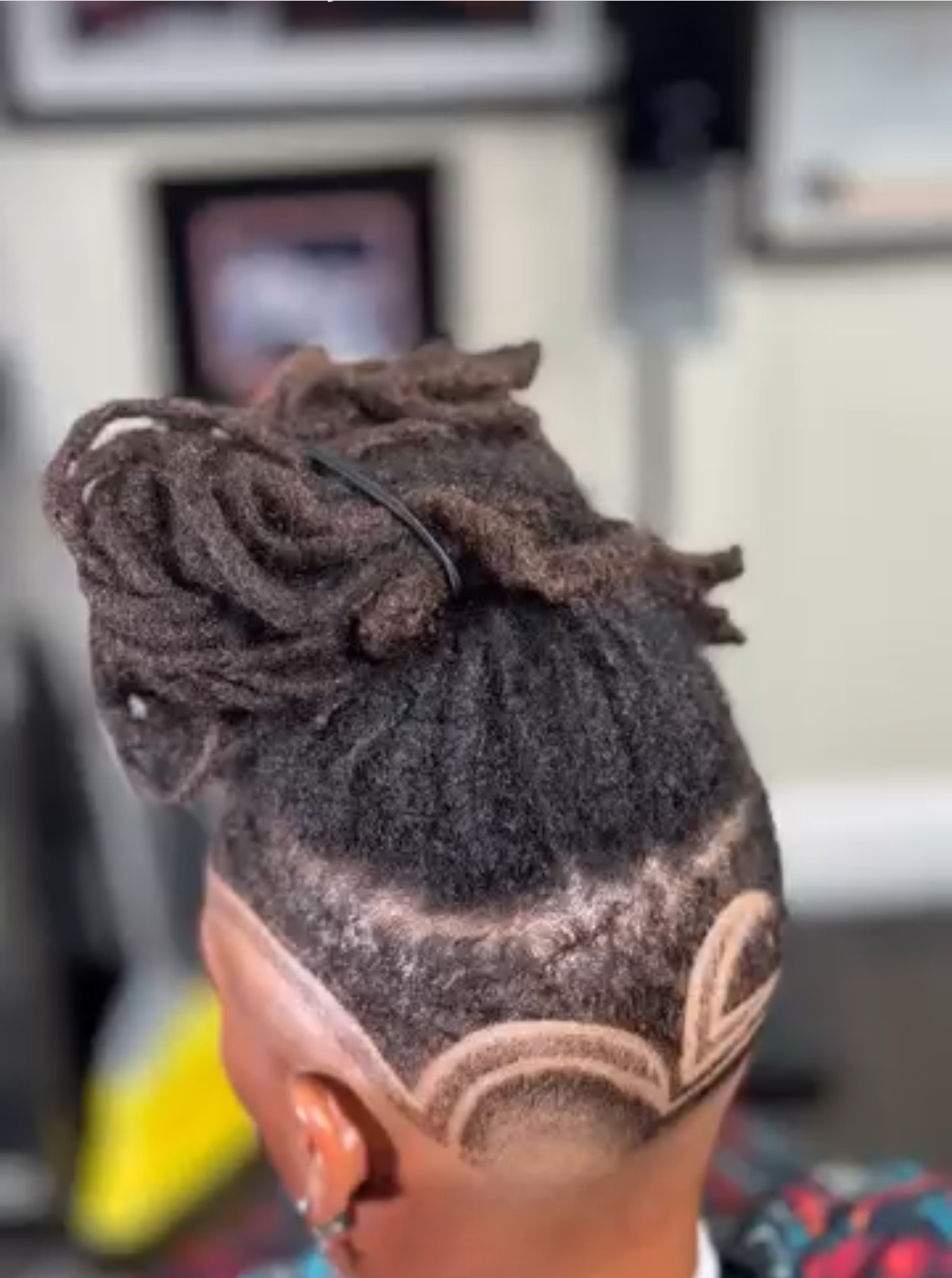 Loc updo with custom hair design